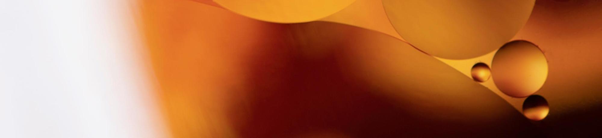 oil droplet closeup, orange and yellow orbs