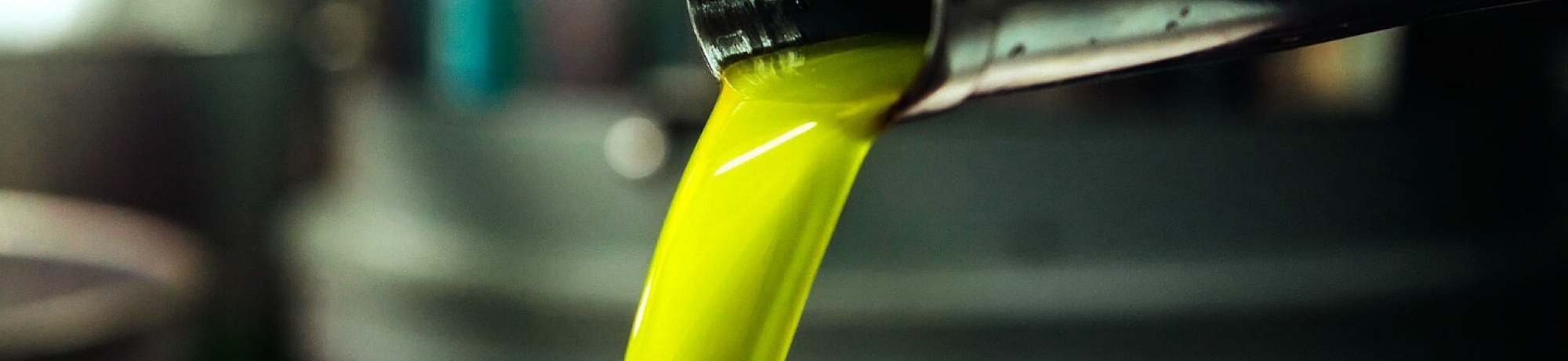 Green olive oil being poured; image from Selina Wang